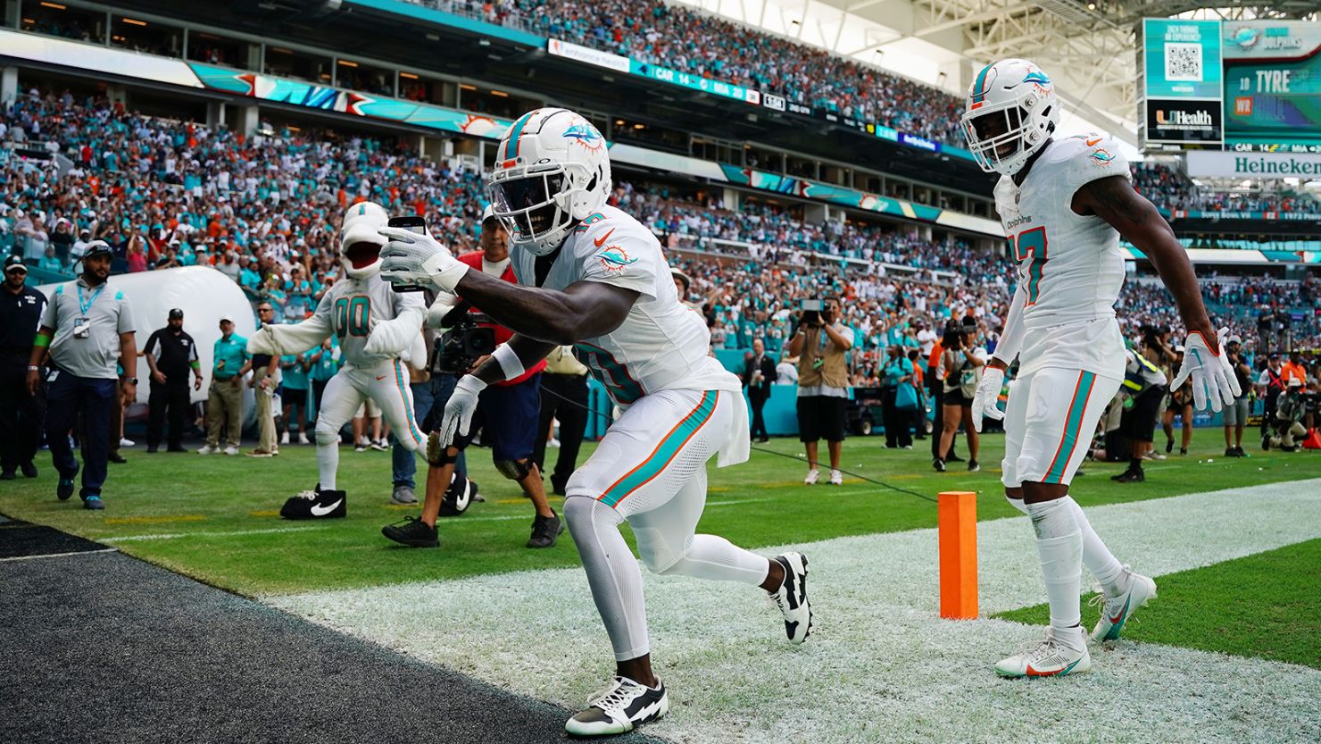 Tyreek Hill #10 of the Miami Dolphins celebrates a touchdown during the first half in the game against the Carolina Panthers at Hard Rock Stadium on October 15, 2023 in Miami Gardens, Florida.