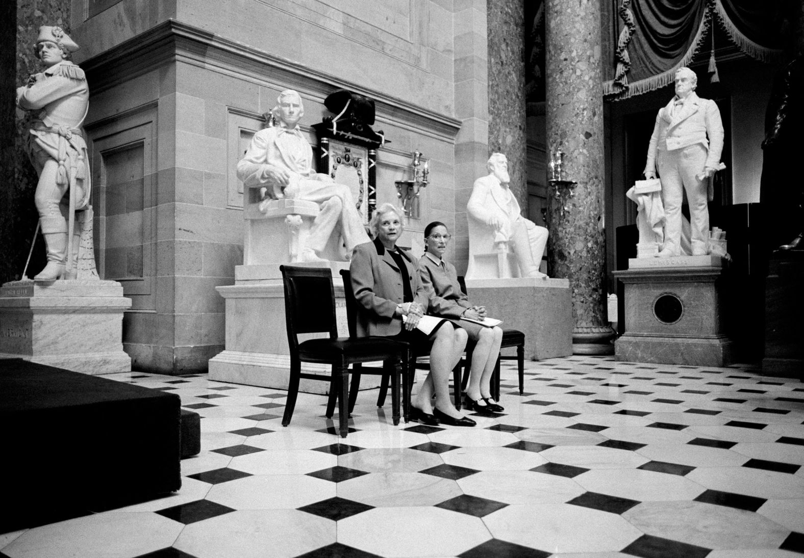 O'Connor and fellow Supreme Court Justice Ruth Bader Ginsburg are surrounded by statues of men as they pose together at the US Capitol in 2001.