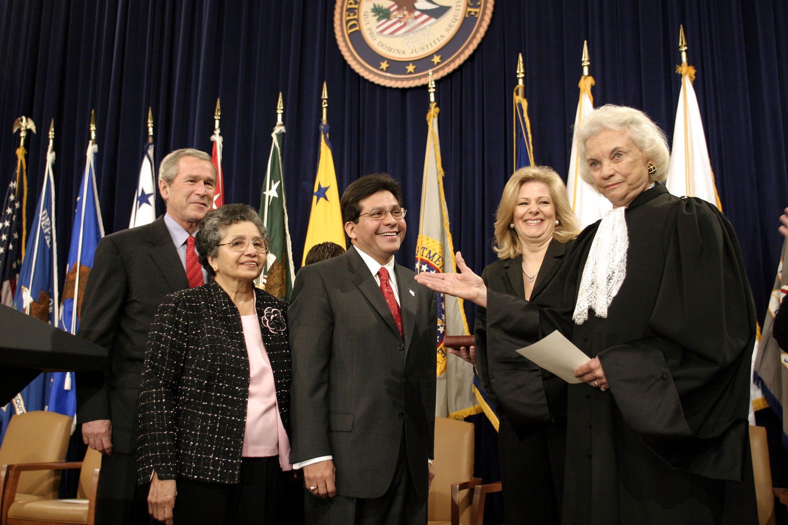 O'Connor is joined by President George W. Bush, left, as she swears in Attorney General Alberto Gonzales in 2005. Gonzales' mother, Maria, is second from left and his wife, Rebecca, is second from right.