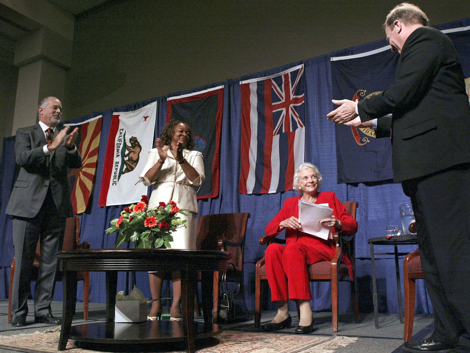O'Connor receives applause after she spoke at a judicial conference in Spokane, Washington, in 2005. This was a few weeks after she announced that she would be retiring from the court to care for her husband, who was ailing from Alzheimer's disease.