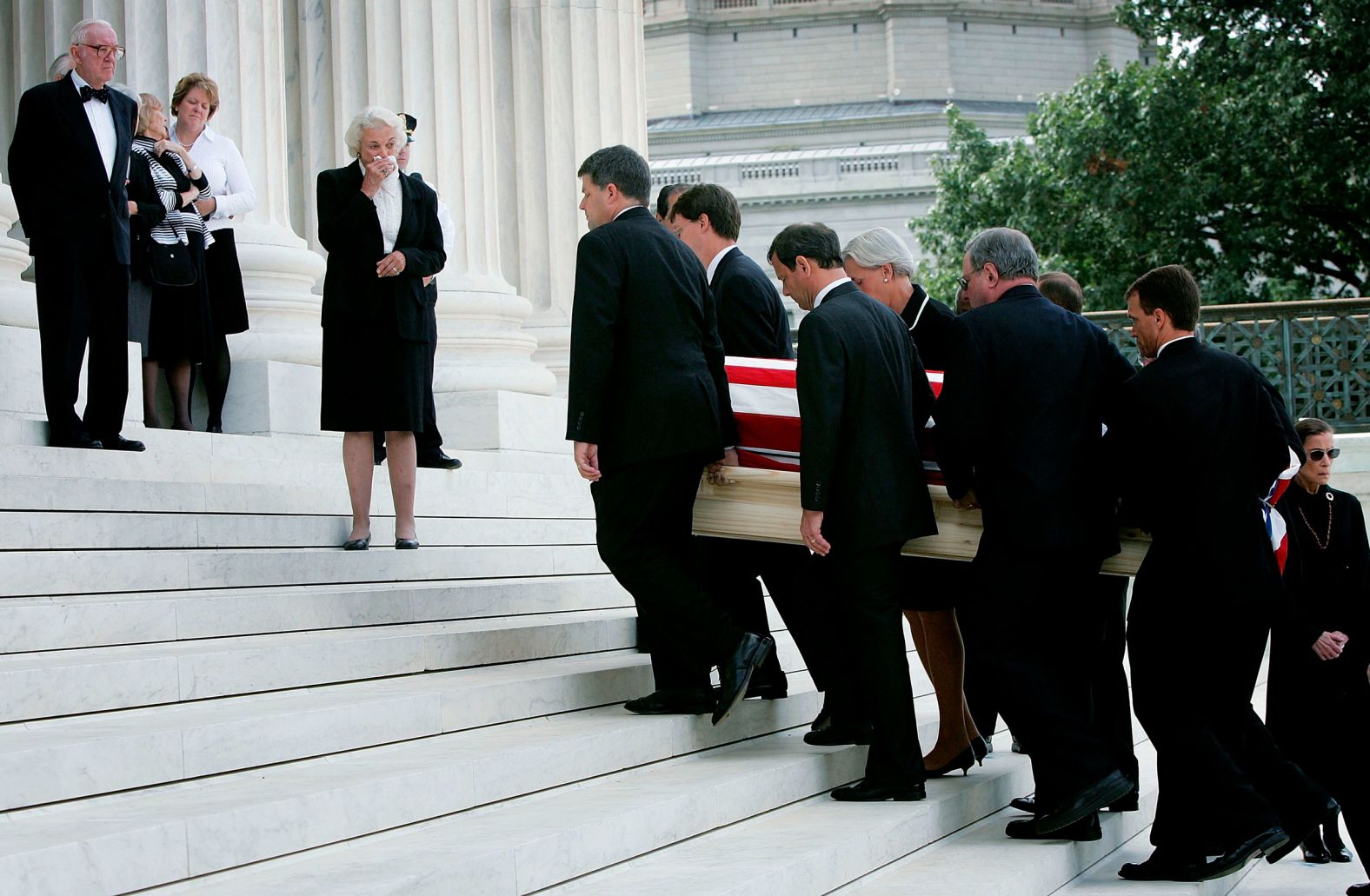 O'Connor weeps as pallbearers carry the casket of former Chief Justice William Rehnquist in 2005. Rehnquist was her classmate at Stanford Law School, and the two once dated.