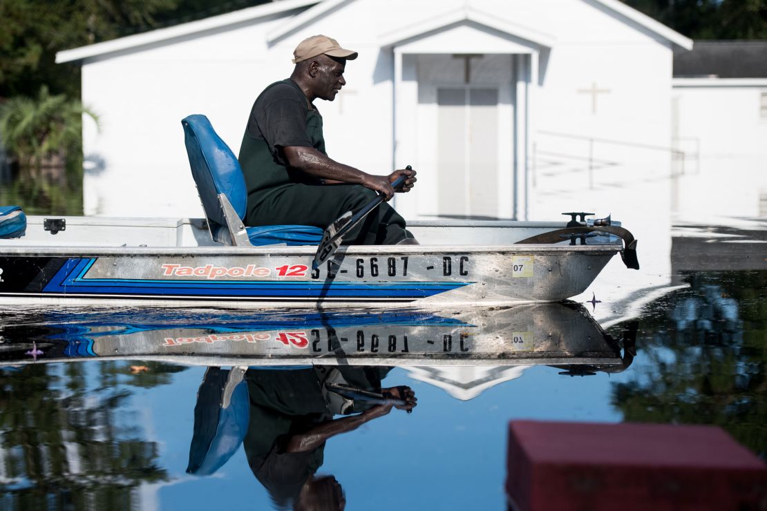 BUCKSPORT, SC - SEPTEMBER 26: A man in a boat navigates floodwaters from the Waccamaw River caused by Hurricane Florence on September 26, 2018 in Bucksport, South Carolina. Nearly two weeks after making landfall in North Carolina, river flooding continues after Florence in northeastern South Carolina. (Photo by Sean Rayford/Getty Images)