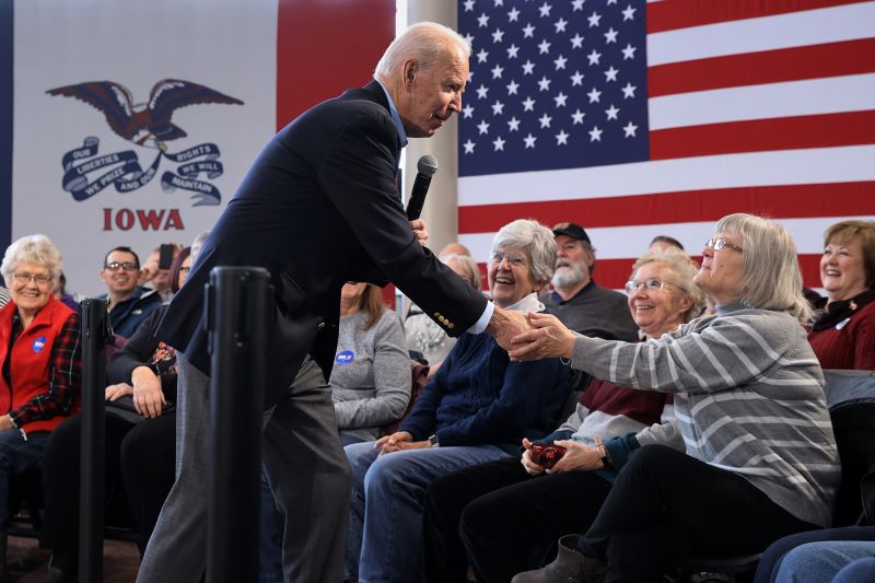 CEDAR FALLS, IOWA - JANUARY 27: Democratic presidential candidate former Vice President Joe Biden greets supporter as he arrives for a campaign town hall event in the Gallagher Bluedorn Performing Arts Center Atrium on the campus of University of Northern Iowa January 27, 2020 in Cedar Falls, Iowa. In a what appears to be a neck-and-neck race, Biden is ahead of rival candidate Sen. Bernie Sanders (I-VT) by 6 points in a USA Today/Suffolk University poll but is running behind Sanders by 8 points according to a New York Times/Siena College poll, both polls of likely Iowa caucus-goers conducted at about the same time. (Photo by Chip Somodevilla/Getty Images)