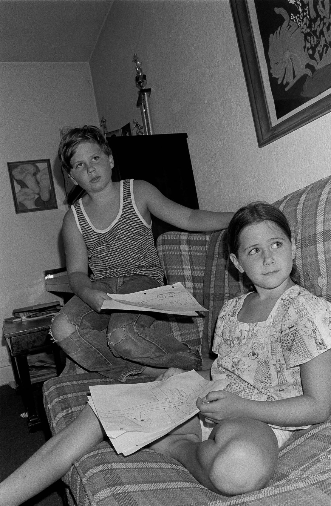 Jeffrey Brown and his sister Jennifer sit at home in their living room as their being interviewed by a newspaper reporter in Chowchilla, Calif., July 21, 1976. The children were kidnapped last Thursday from their school bus. They escaped from the kidnappers along with 26 other children and were returned to their parents early on Saturday.  (AP Photo)