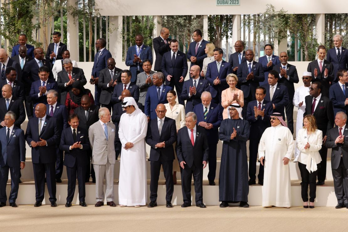 DUBAI, UNITED ARAB EMIRATES - DECEMBER 01: Heads of states, including Brunei Sultan Hassanal Bolkiah, King Charles III, Qatari Emir Sheikh Tamim bin Hamad Al Thani, Simon Stiell, Executive Secretary of the United Nations Framework Convention on Climate Change, UN Secratary General Antonio Guterres, UAE President Mohamed bin Zayed Al Nahyan, Italian Prime Minister Giorgia Meloni, prepare to pose for a family photo during day one of the high-level segment of the UNFCCC COP28 Climate Conference at Expo City Dubai on December 01, 2023 in Dubai, United Arab Emirates. The COP28, which is running from November 30 through December 12, brings together stakeholders, including international heads of state and other leaders, scientists, environmentalists, indigenous peoples representatives, activists and others to discuss and agree on the implementation of global measures towards mitigating the effects of climate change. (Photo by Sean Gallup/Getty Images)