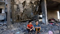 TOPSHOT - Children sit amid the rubble of a building in the aftermath of an Israeli strike in Rafah in the southern Gaza Strip on November 10, 2023, during ongoing battles between Israel and the Palestinian group Hamas. (Photo by Mohammed ABED / AFP) (Photo by MOHAMMED ABED/AFP via Getty Images)