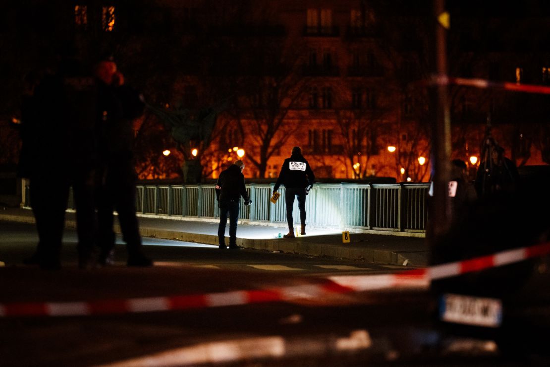 Forensic police work at the scene of a stabbing in Paris on December 2, 2023. A person known to the French authorities as a radical Islamist with mental health troubles stabbed a German tourist to death and wounded two people in central Paris on December 2 before being arrested, officials said. (Photo by Dimitar DILKOFF / AFP)