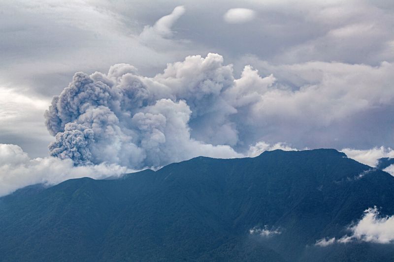 Volcanic ash spews from Mount Marapi during an eruption as seen from Tanah Datar in West Sumatra on December 3, 2023.