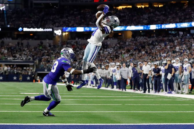 Dallas Cowboys wide receiver Brandin Cooks catches a pass for a first down as Seattle Seahawks safety Jamal Adams defends during the Cowboys' 41-35 Thursday Night Football win on November 30.