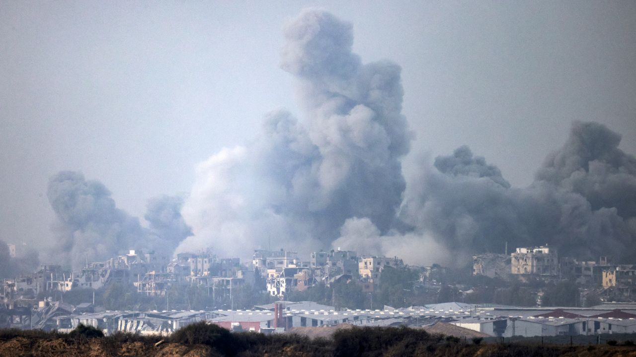 This picture taken from southern Israel near the border with the Gaza Strip on December 3, 2023, shows smoke billowing over the Palestinian enclave during Israeli bombardment amid continuing battles between Israel and the militant group Hamas. Israel carried out deadly bombardments in Gaza on December 3 as international calls mounted for greater protection of civilians and the renewal of an expired truce with Palestinian militant group Hamas. (Photo by Menahem KAHANA / AFP) (Photo by MENAHEM KAHANA/AFP via Getty Images)
