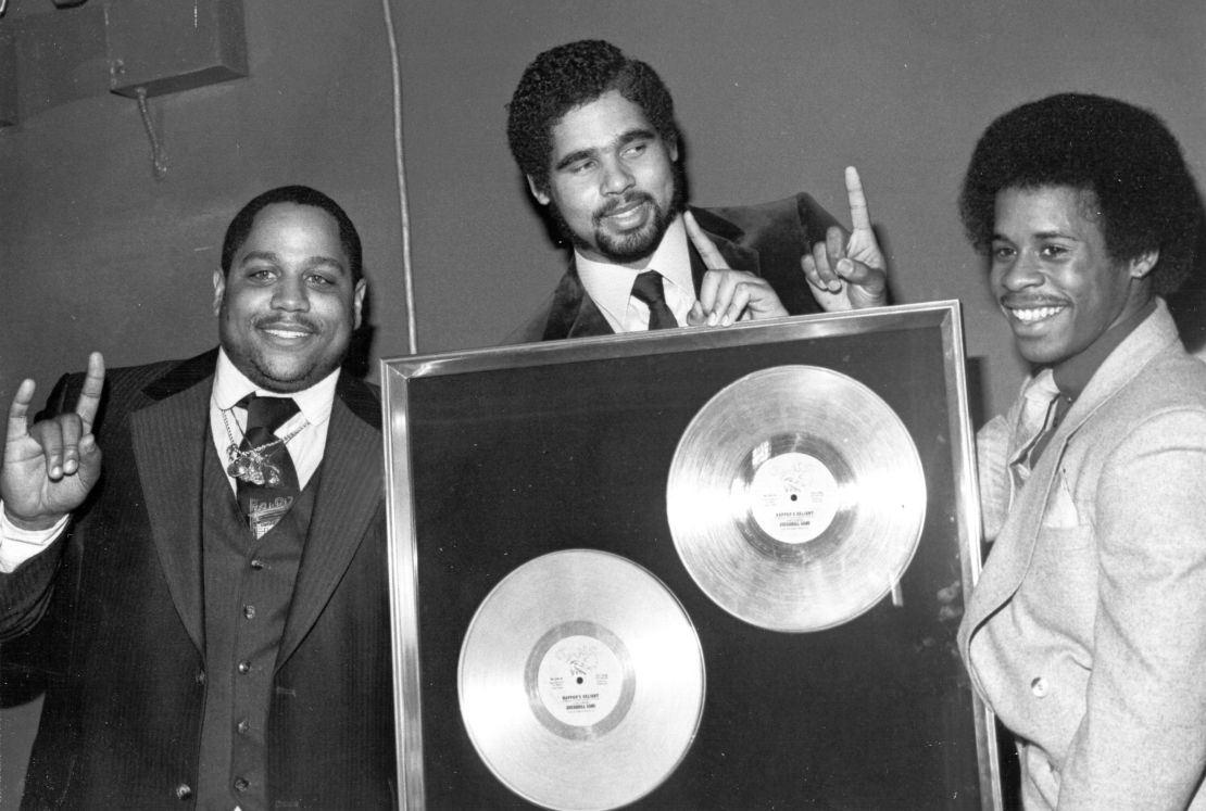 CIRCA 1980:  Rap pioneers the Sugar Hill Gang (L-R Big Bank Hank, Wonder Mike and Master G receive their gold record for 'Rapper's delight) circa 1980. (Photo by Michael Ochs Archives/Getty Images)