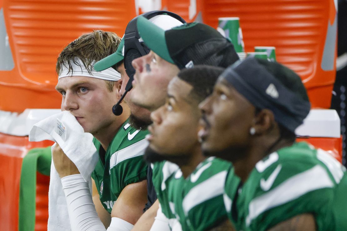 New York Jets quarterback Zach Wilson sits on the bench during the second half of an NFL football game against the Dallas Cowboys in Arlington, Texas, Sunday, Aug. 17, 2023. (AP Photo/Michael Ainsworth)