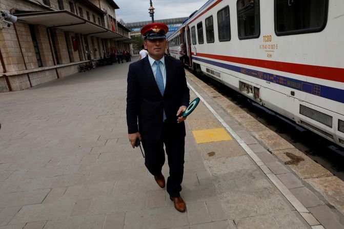 <strong>All aboard: </strong>A railway official makes his last checks before the Eastern Express departs after a short stop at the eastern Anatolian city of Erzincan.
