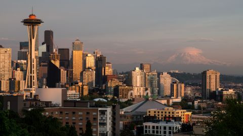 Seattle, USA - May 16, 2023: The Puget Sound Seattle skyline at sunset with Mt Rainier.