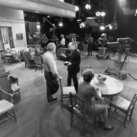 Lear, at center in the dark blazer, talks with Carroll O'Connor on the set of "All in the Family" in 1971. That year, it won a Primetime Emmy for outstanding new series.