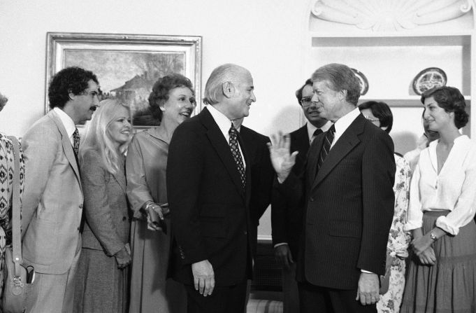 President Jimmy Carter greets Lear and cast members from "All in the Family" as they visit the White House in 1978.