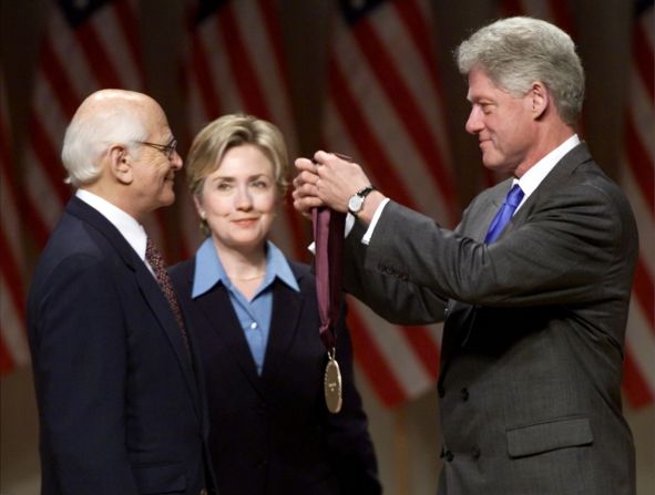 President Bill Clinton awards Lear with a National Medal of the Arts as first lady Hillary Clinton looks on in 1999.