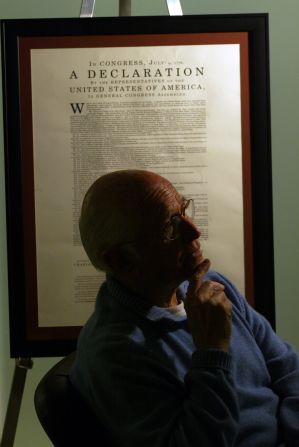 Lear sits at a conference room table in his Beverly Hills office in 2002. Behind him is a copy of an early draft of the Declaration of Independence. He was sponsoring a traveling exhibit about the original document.