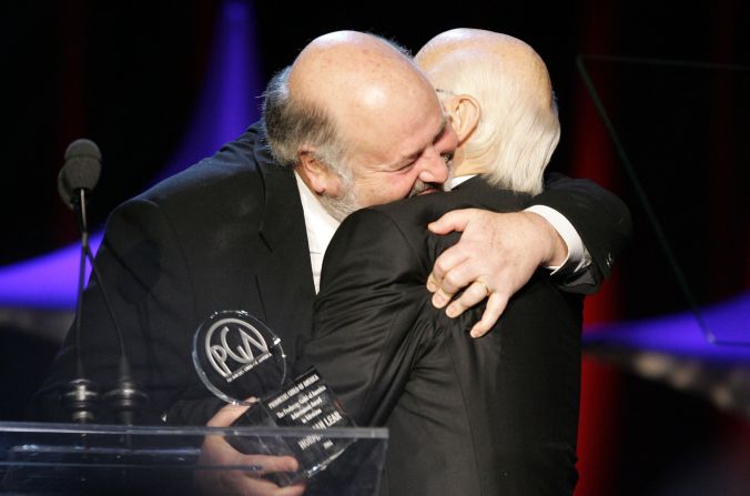 Rob Reiner, left, presents Lear with the Producers Guild Achievement Award in Television in 2006. Reiner was one of the stars of "All in the Family."
