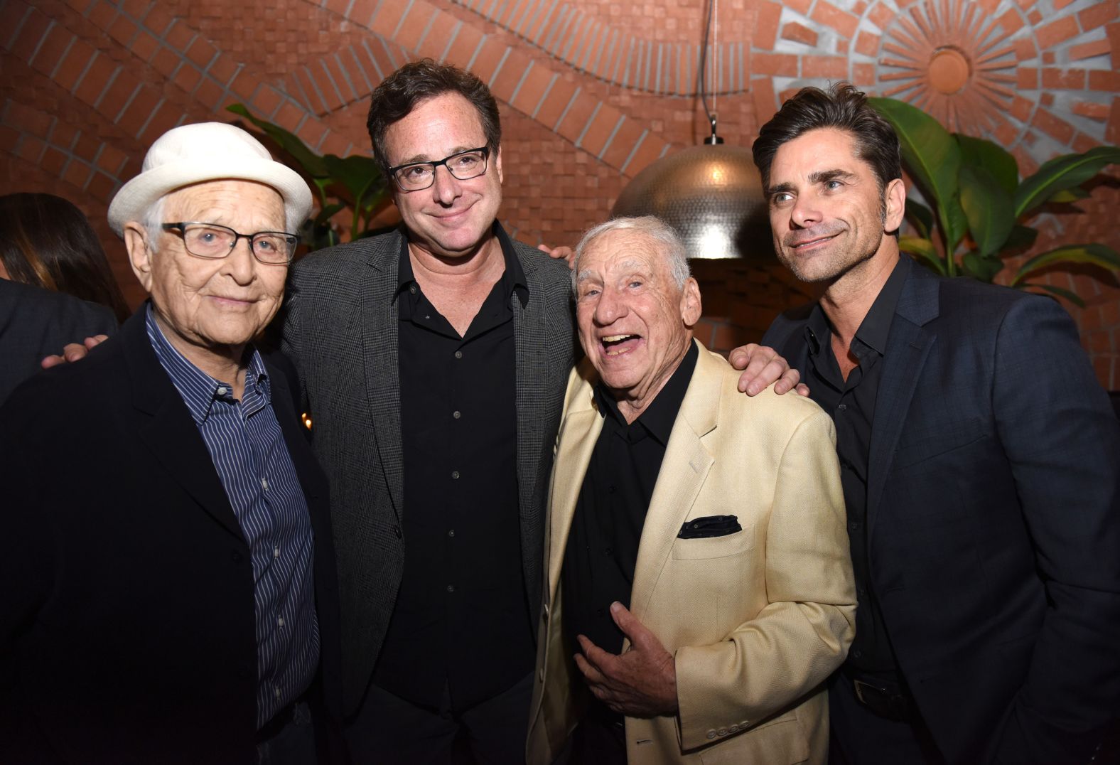 From left, Lear, Bob Saget, Mel Brooks and John Stamos attend the Los Angeles premiere of the documentary "Norman Lear: Just Another Version of You" in 2016.