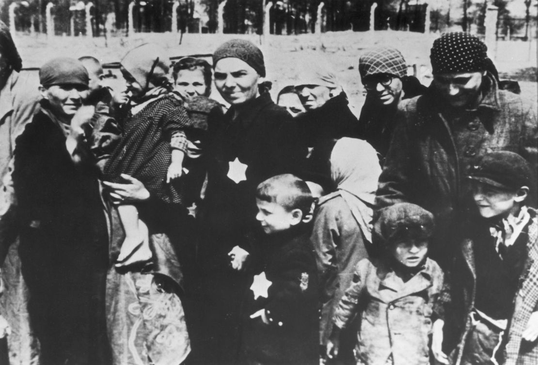 circa 1943:  Jewish women and children, some wearing the yellow Star of David patch on their chests, at Auschwitz concentration camp, Poland, undergoing selections. Many were sent immediately for gassing by Dr Josef Mengele, the head doctor of the concentration camp.  (Photo by Hulton Archive/Getty Images)