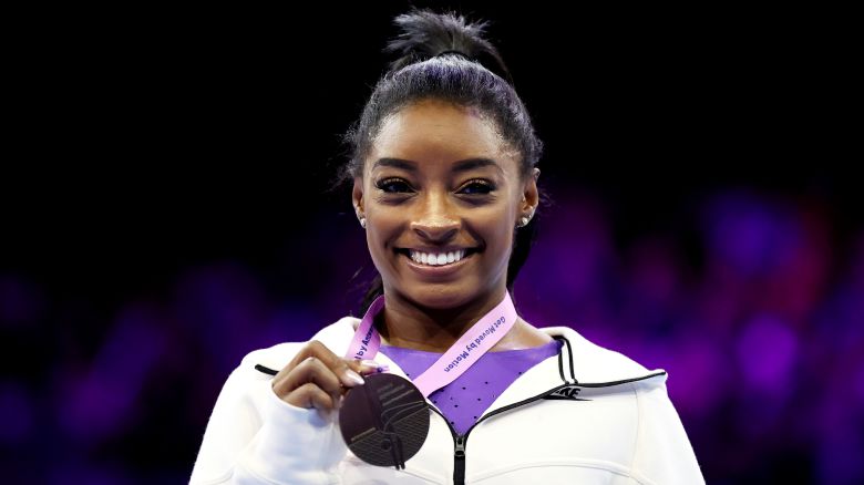ANTWERP, BELGIUM - OCTOBER 08: Simone Biles of Team United States celebrates winning gold on the Beam on Day Nine of the 2023 Artistic Gymnastics World Championships at Antwerp Sportpaleis on October 08, 2023 in Antwerp, Belgium. (Photo by Naomi Baker/Getty Images)