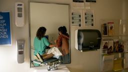 ALBUQUERQUE, NM - JUNE 23, 2022: A family physician and her resident perform an ultrasound on a 39-year-old woman who already has four children the day before the Supreme Court overturned Roe v. Wade at the Center for Reproductive Health clinic on June 23, 2022 in Albuquerque, New Mexico. She later had a surgical abortion at the clinic. New Mexico  will see an influx of patients from neighboring states which have banned abortion. The doctor does not want to be identified for security reasons.(Gina Ferazzi / Los Angeles Times via Getty Images)