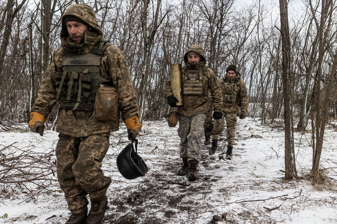 KHARKIV OBLAST, UKRAINE - NOVEMBER 27: Ukrainian soldiers of the 57th Brigade walk with the remains of a powder charge in their fighting position, in the direction of Kupiansk in Kharkiv Oblast of Ukraine on November 27, 2023. (Photo by Diego Herrera Carcedo/Anadolu via Getty Images)