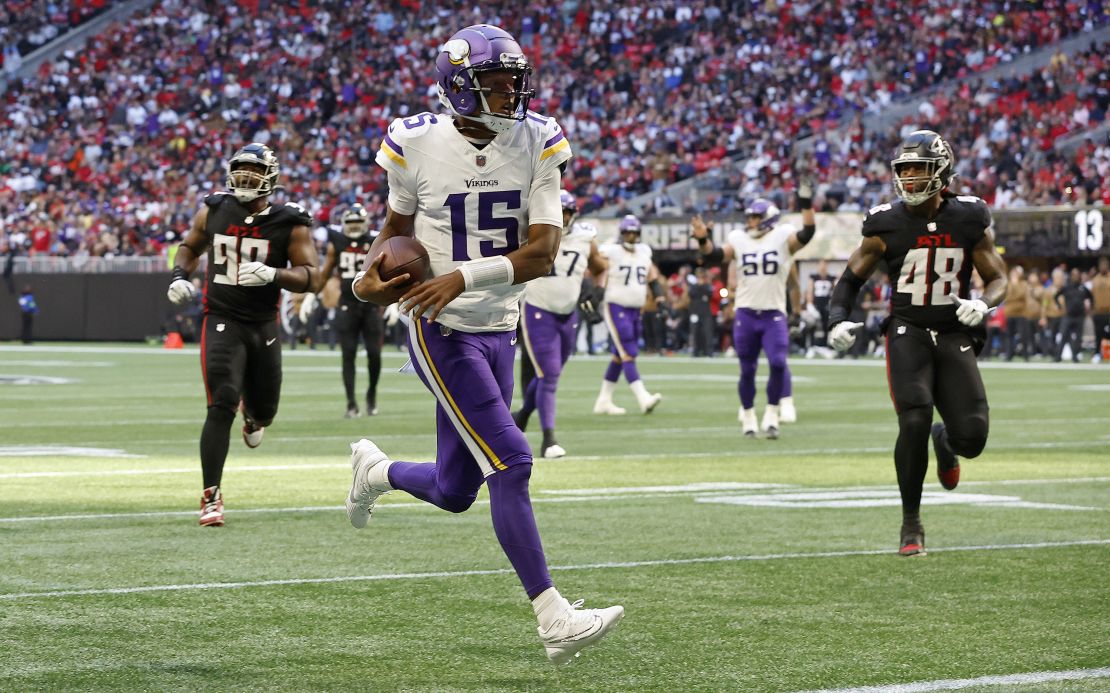 ATLANTA, GEORGIA - NOVEMBER 05: Joshua Dobbs #15 of the Minnesota Vikings runs the ball in for a touchdown during the third quarter of the game against the Atlanta Falcons at Mercedes-Benz Stadium on November 05, 2023 in Atlanta, Georgia. (Photo by Alex Slitz/Getty Images)