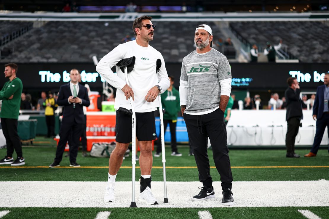 Aaron Rodgers #8 of the New York Jets stands on the field holding crutches prior to an NFL football game against the Kansas City Chiefs at MetLife Stadium on October 1, 2023 in East Rutherford, New Jersey.