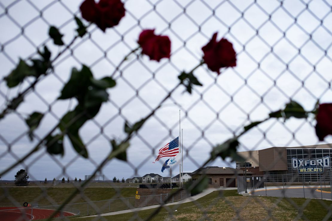 OXFORD, MI - DECEMBER 07: Roses hang from a fence to honor the victims from last weeks shooting outside of Oxford High School on December 7, 2021 in Oxford, Michigan. One week ago, four students were killed and seven others injured on November 30, when student Ethan Crumbley allegedly opened fire with a pistol at the school.15-year-old Ethan Crumbley has been charged along with his parents James and Jennifer Crumbley who have been charged with four counts of involuntary manslaughter (Photo by Emily Elconin/Getty Images)