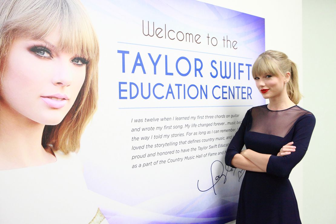 NASHVILLE, TN - OCTOBER 12:  Singer Taylor Swift officially opens the Taylor Swift Education Center at the Country Music Hall of Fame and Museum on October 12, 2013 in Nashville, Tennessee. Seven-time GRAMMY winner Swift's $4 million gift to endow the center is the largest individual artist gift in the Hall of Fame's history. (Photo by Royce DeGrie/TAS/Getty Images for TAS)