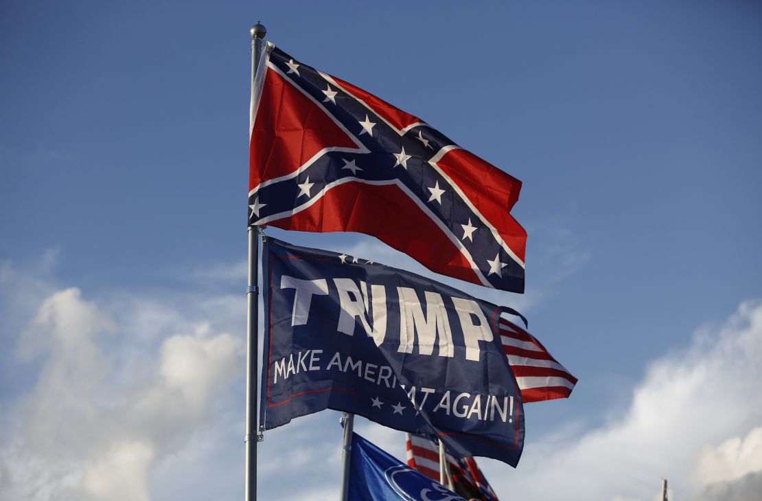 BRISTOL, TN - AUGUST 17: A Trump "Make America Great Again!" flag flies below the confederate flag over the Peary's RV in Earhart Campground, a private campground adjacent to the Bristol Motor Speedway in Bristol, TN on Aug. 18, 2017. (Photo by Jessica Rinaldi/The Boston Globe via Getty Images)