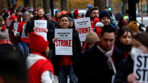 Washington Post staff walk a picket line at the start of a 24-hour strike amid prolonged contract talks outside The Washington Post building in Washington, U.S., December 7, 2023.