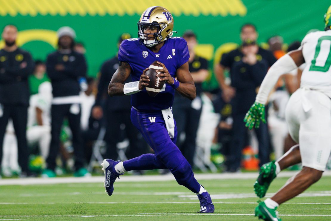 Washington Huskies quarterback Michael Penix Jr. (9) rolls out to pass during the Pac-12 Championship NCAA college football game against Oregon, Friday, Dec. 1 2023 in Las Vegas.