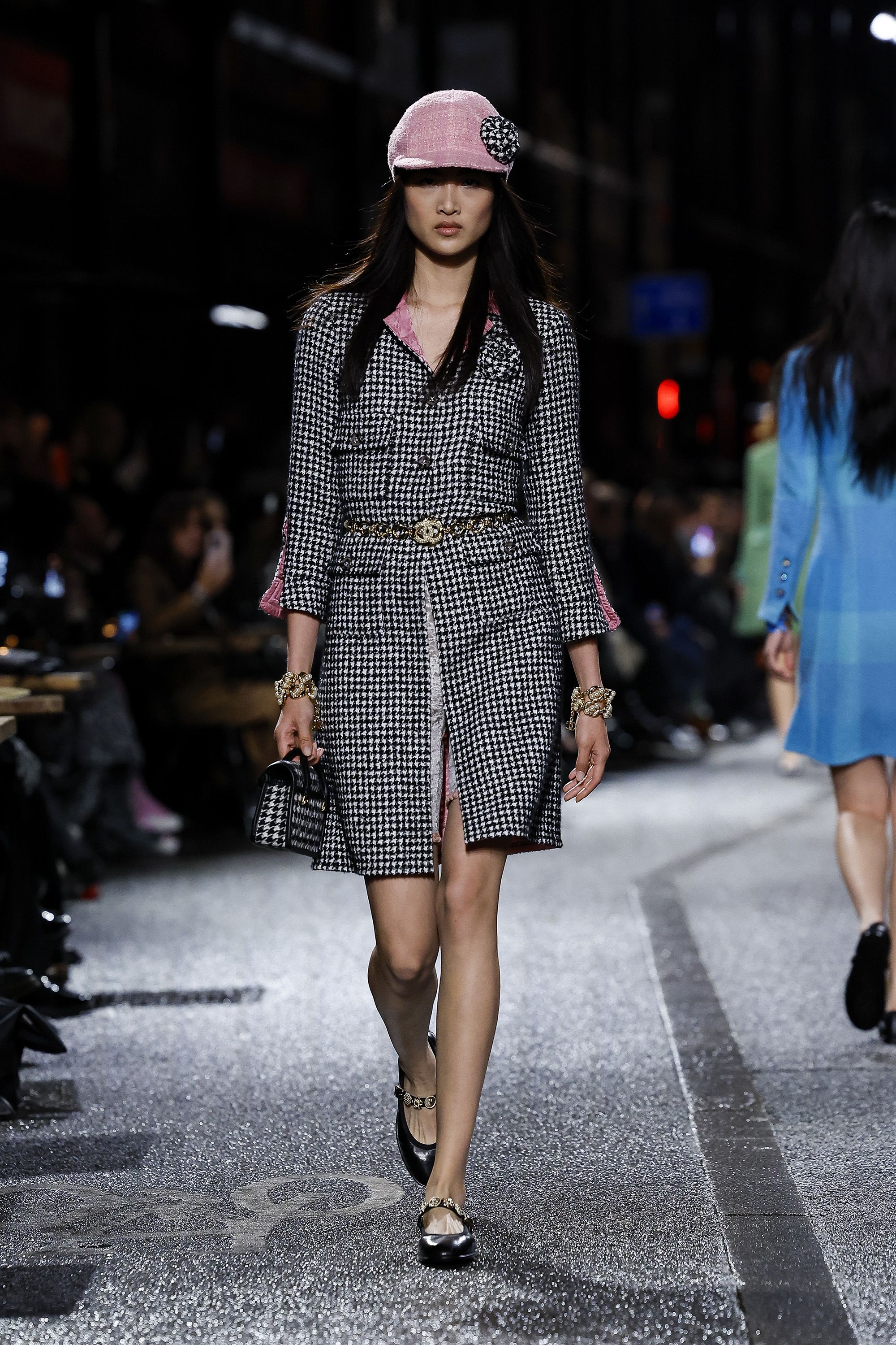 Houndstooth coats were cinched at the waist with gold Chanel belts.