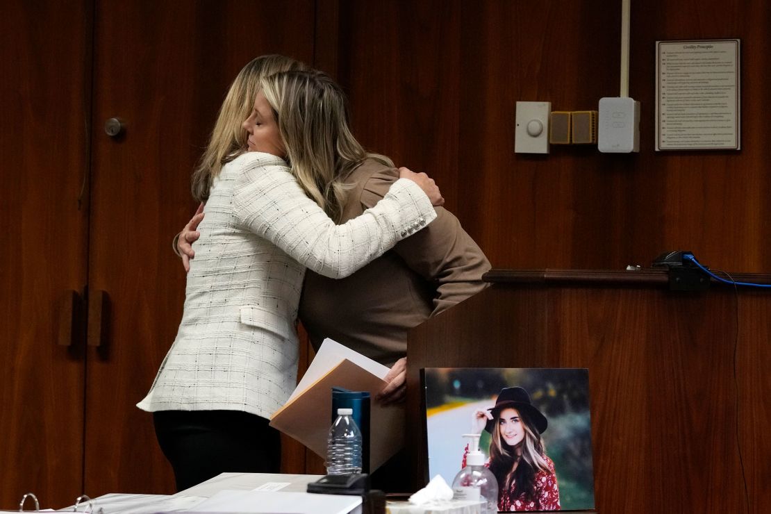 Oakland County prosecutor Karen McDonald hugs Nicole Beausoleil, mother of Madisyn Baldwin, after Nicole's victim impact statement, Friday, Dec. 8, 2023, in Pontiac, Mich. Parents of students killed at Michigan's Oxford High School described the anguish of losing their children Friday as a judge considered whether Ethan Crumbley, a teenager, will serve a life sentence for a mass shooting in 2021.  (AP Photo/Carlos Osorio)