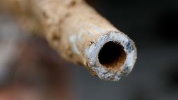 A lead pipe is shown after being replaced by a copper water supply line to a home in Flint, Mich., July 20, 2018.