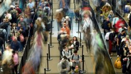 In this long-exposure photo, travelers wait in a security line at Denver International Airport on Tuesday, November 21, in Denver.