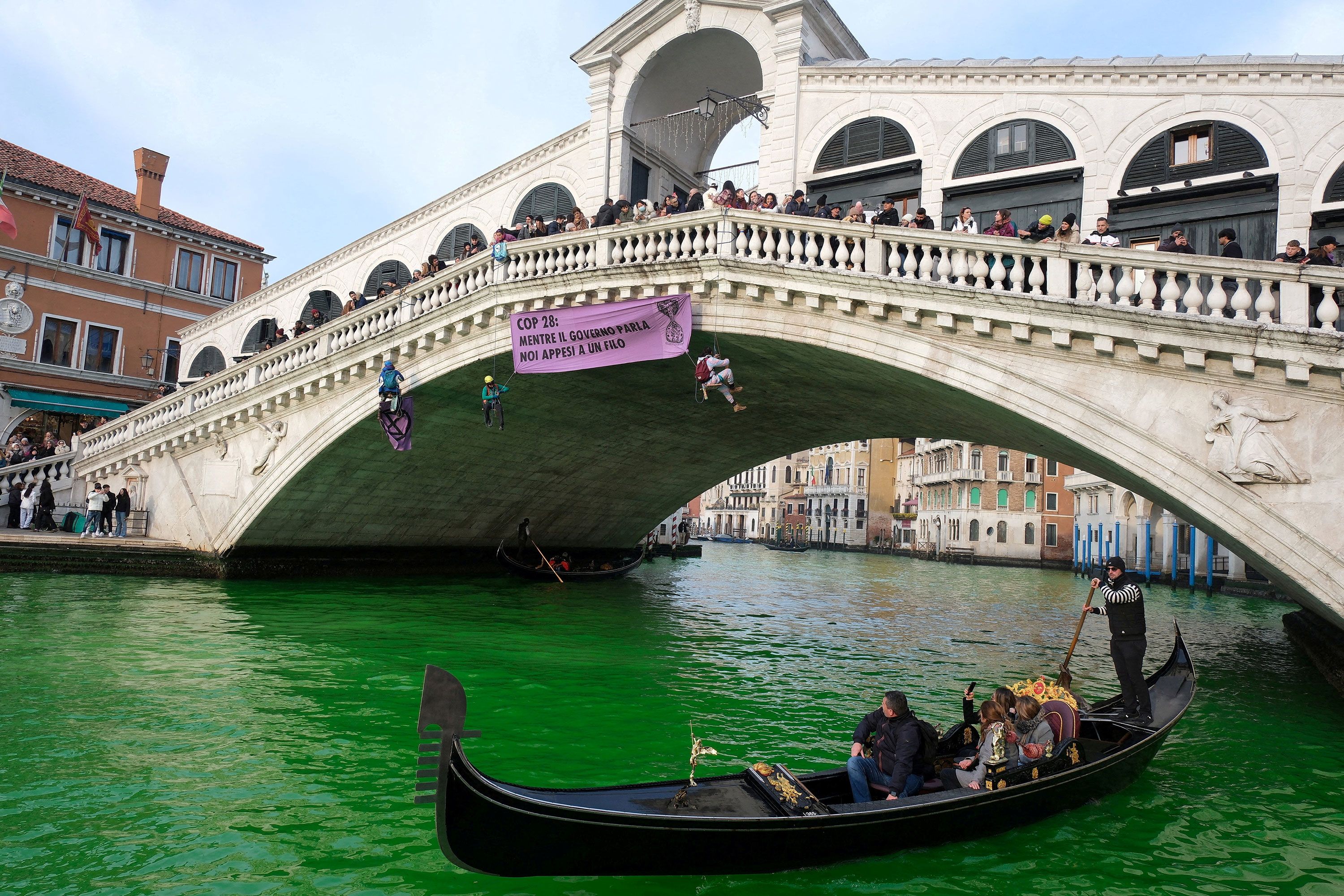 Police solve the mystery of why Venice's Grand Canal turned bright green