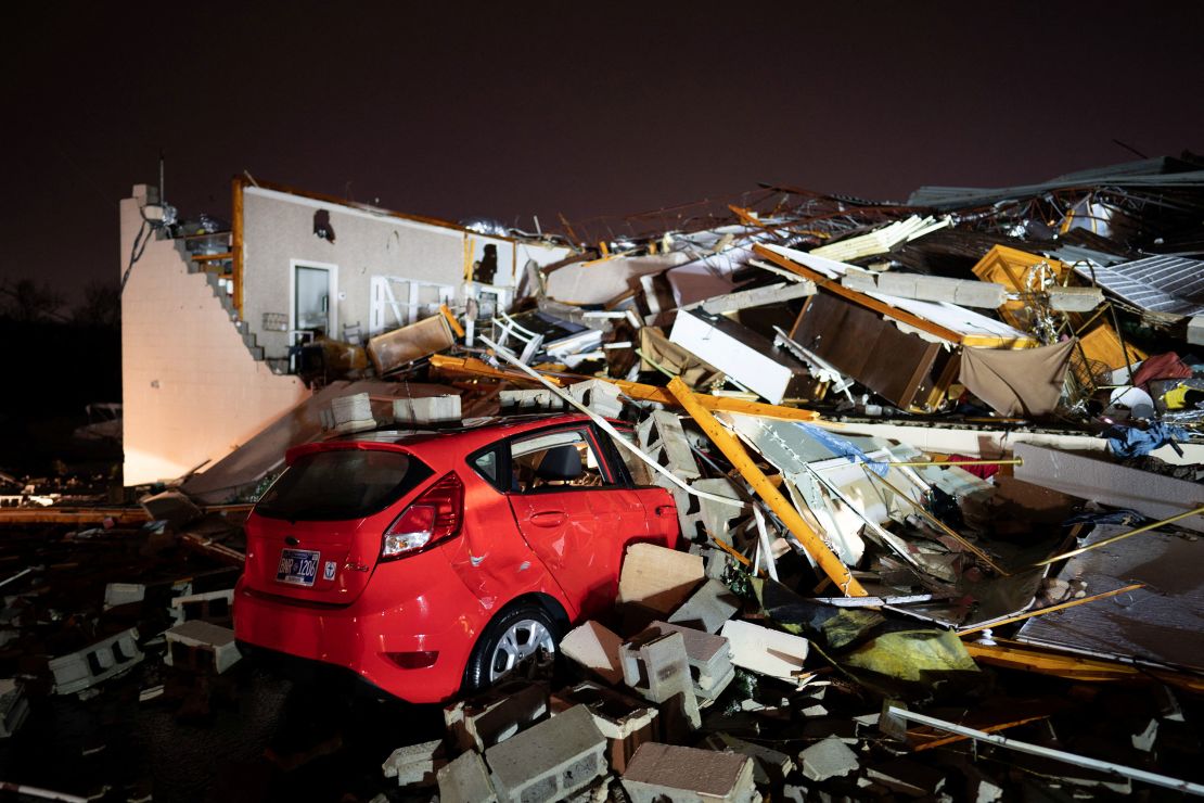 A car is buried under rubble on Main Street after a tornado hit Hendersonville, Tennessee, U.S. December 9, 2023.