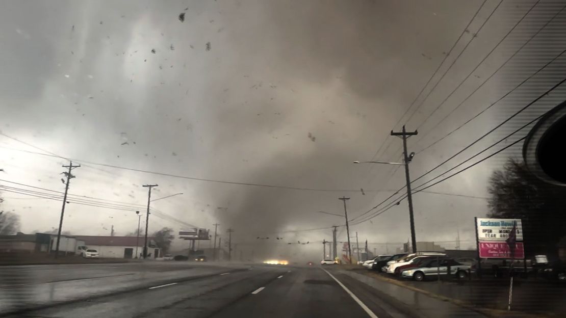 A tornado passes directly in front of storm chasers in Clarksville, Tennessee, on Saturday, December 9.