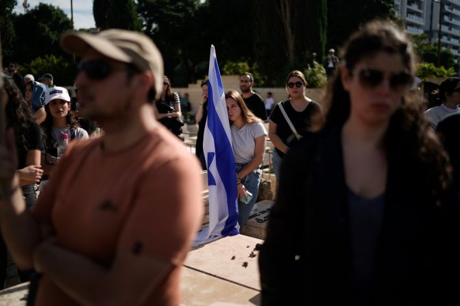 Mourners attend the funeral of Israeli soldier Master Sgt. Gal Meir Eisenkot, 25, <a href="https://www.cnn.com/2023/12/07/middleeast/israel-idf-war-cabinet-son-killed-gaza-intl/index.html" target="_blank">who was killed in fighting in Gaza</a>, at the military cemetery in Herzliya, Israel, on December 8. The death of Eisenkot, the son of Israeli government minister Gadi Eisenkot, has resonated across the country and drawn condolences from Israel's top leaders.