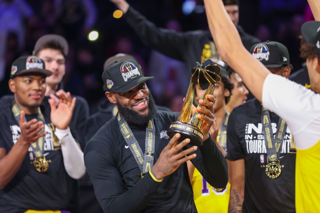 Los Angeles Lakers forward LeBron James lifts the NBA In-Season Tournament MVP award after the Lakers defeated the Indiana Pacers 123-109 in the championship game in the NBA basketball In-Season Tournament on Saturday, Dec. 9, 2023, in Las Vegas.(AP Photo/Ian Maule)