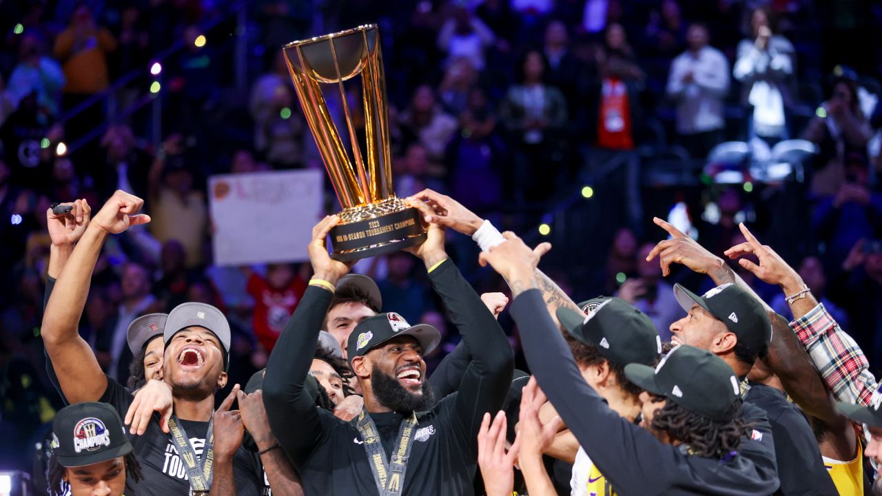 Los Angeles Lakers forward LeBron James, center, lifts the the NBA Cup while celebrating with teammates after they defeated the Indiana Pacers 123-109 in the championship game in the NBA basketball In-Season Tournament on Saturday, Dec. 9, 2023, in Las Vegas.(AP Photo/Ian Maule)