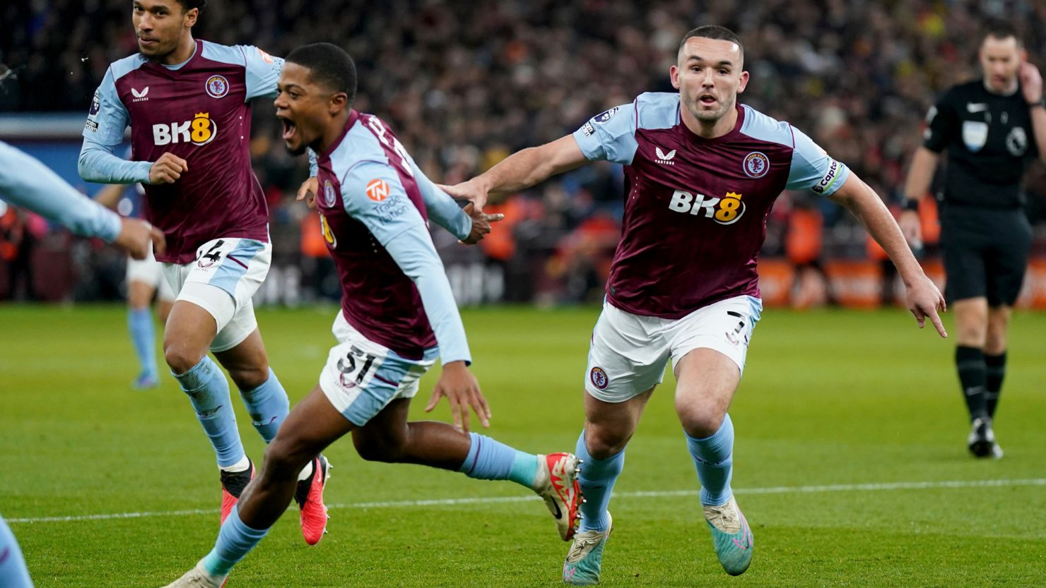 Aston Villa's John McGinn (right) celebrates after scoring his sides first goal of the game during the Premier League match at Villa Park, Birmingham. Picture date: Saturday December 9, 2023. 74806101 (Press Association via AP Images)