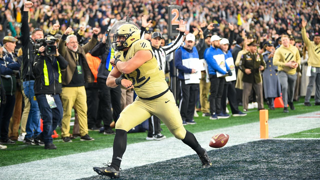 December 9, 2023: Army Black Knights TE Tyson Riley (32) celebrates after scoring a touchdown during an NCAA football game between the Army Black Knights and the Navy Midshipmen at Gillette Stadium in Foxborough, MA.