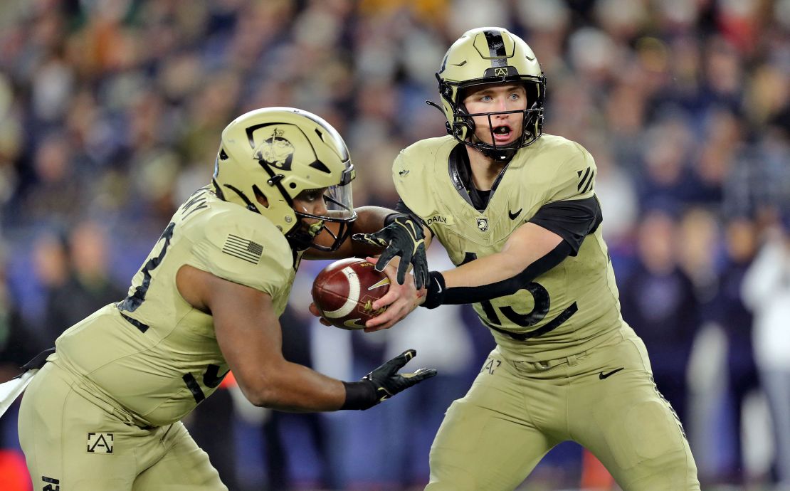 Dec 9, 2023; Foxborough, Massachusetts, USA; Army Black Knights quarterback Bryson Daily (13) hands off the ball to running back Jakobi Buchanan (33) against the Navy Midshipmen during the second half of the Army-Navy Game at Gillette Stadium.