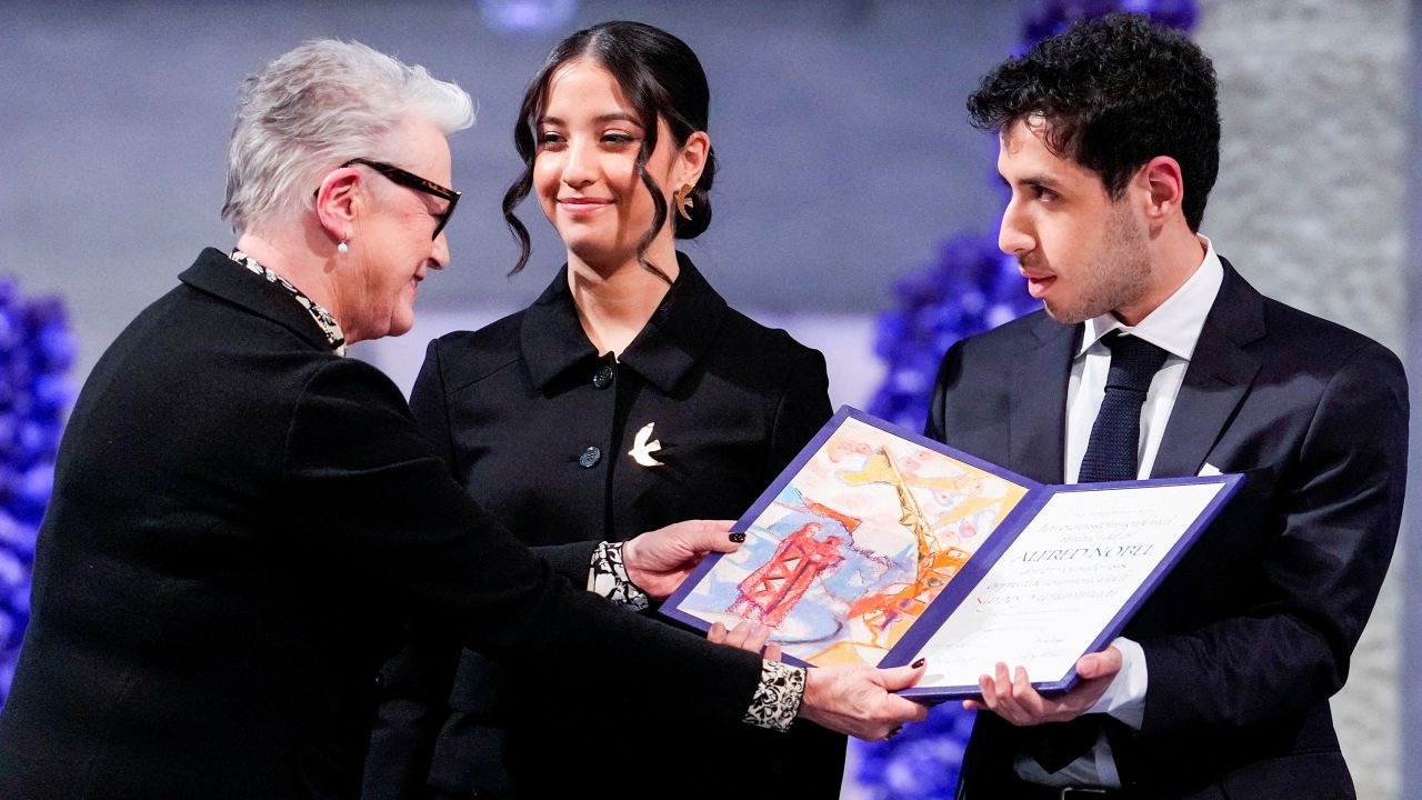 Leader of the Nobel Committee Berit Reiss-Andersen presents Ali and Kiana Rahmani, children of Narges Mohammadi, an imprisoned Iranian human rights activist, with the Nobel Peace Prize 2023, as they accept the award on behalf of their mother at Oslo City Hall, Norway December 10, 2023.
