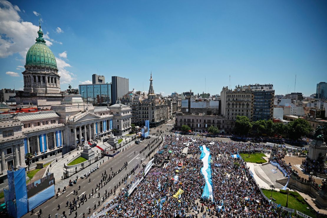 Supporters of Argentina's President-elect Javier Milei gather outside the Congress during the inauguration ceremony of Argentina's President-elect Javier Milei, in Buenos Aires on December 10, 2023.